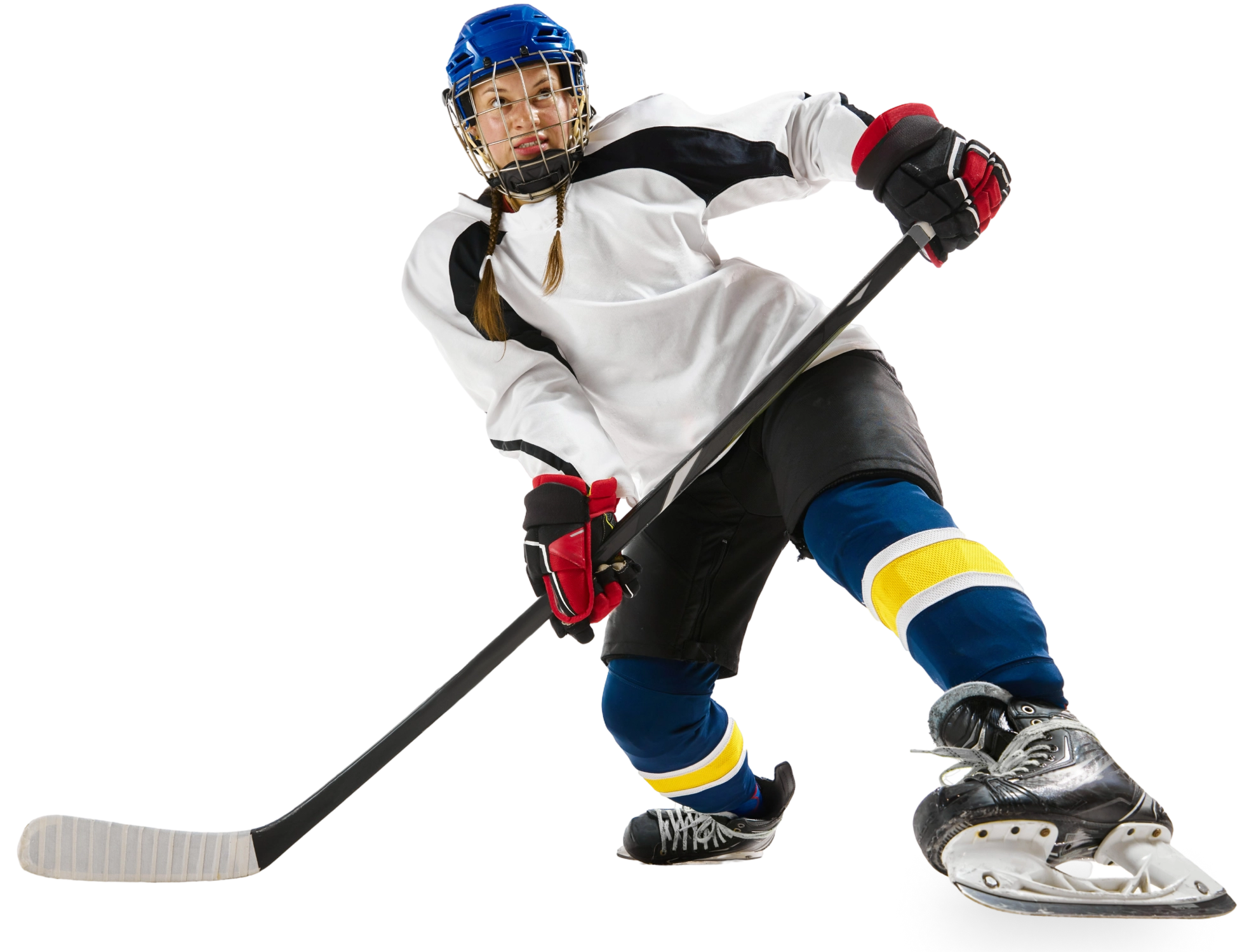 Female hockey player skating with stick.