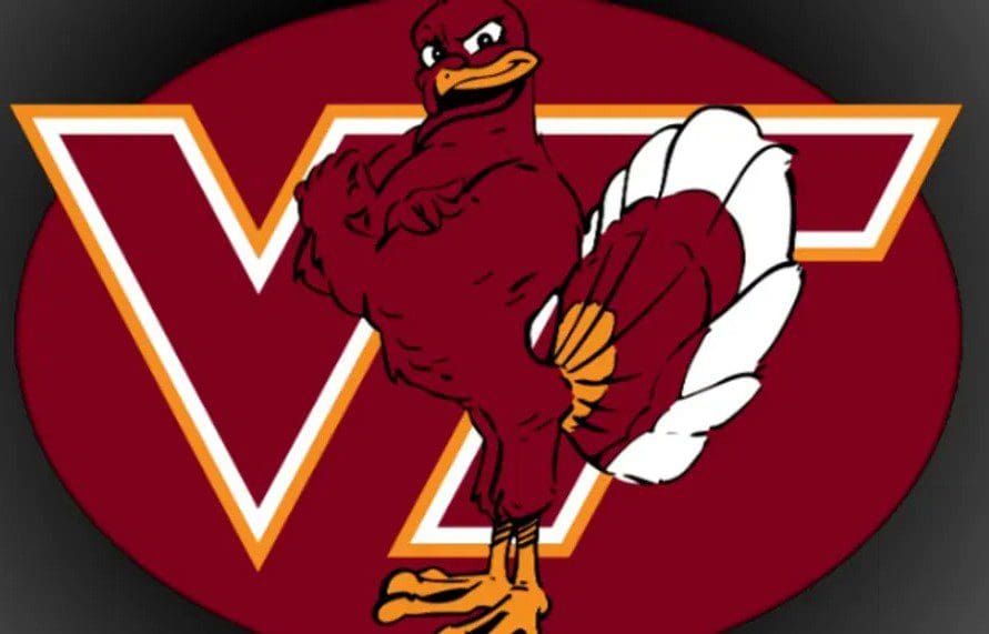 Virginia Tech Hokies mascot holding a basketball in front of the VT logo.