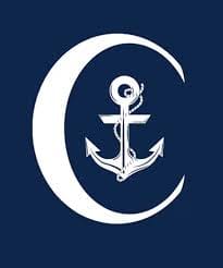 White anchor inside a crescent on blue background.
