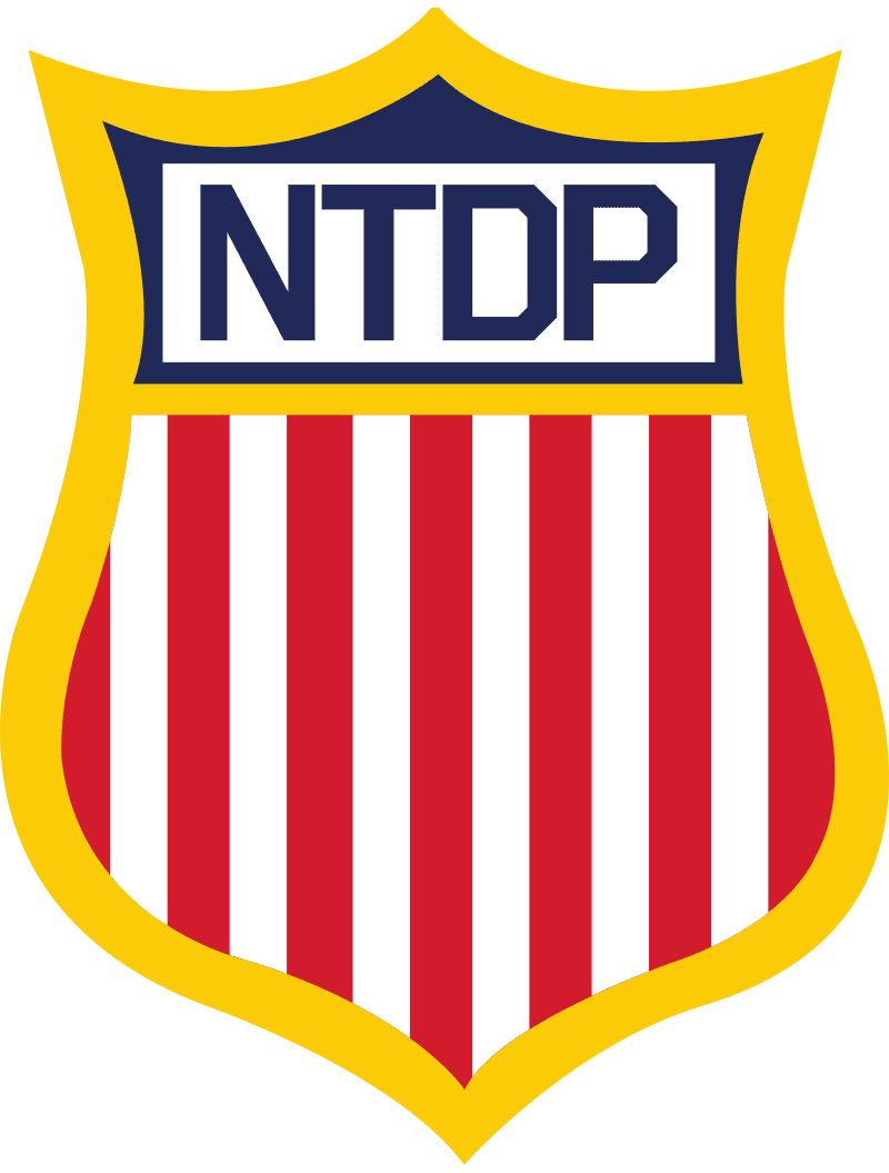 Shield-shaped emblem with NTDP and red-white stripes.
