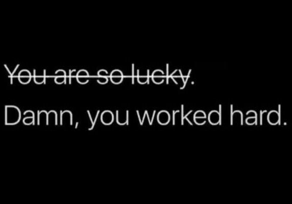 A motivational quote about hard work and luck on a dark background.