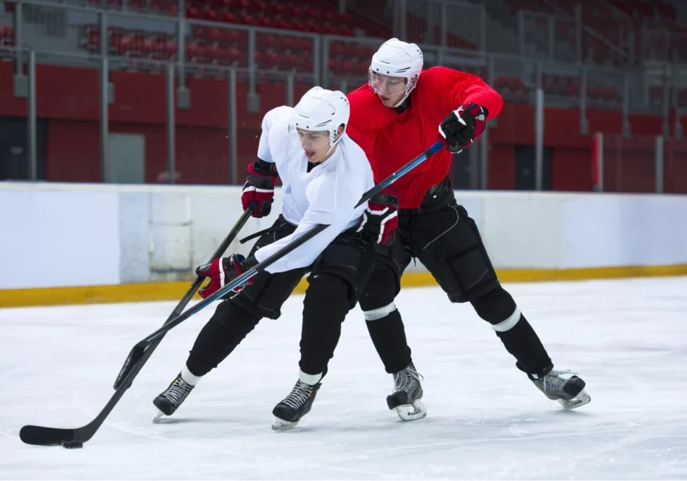 Hockey players battling for the puck.