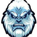 Fierce yeti mascot with icy blue and white fur, showing sharp teeth and a determined expression.