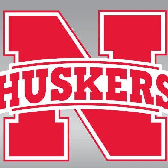 Red Huskers logo with a bold 'N' on a gray background.