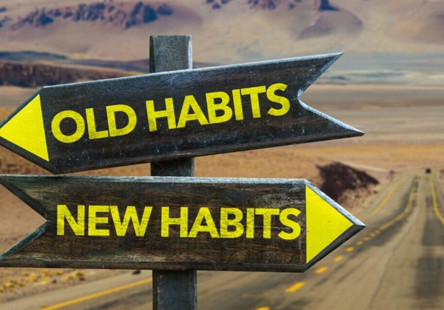 Directional signs contrasting old habits with new habits.